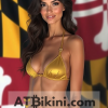 Maryland bikini contest woman in Golden bikini in front of Maryland state flag lookalike