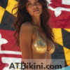Maryland bikini contest woman in Golden bikini in front of Maryland state flag lookalike