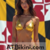 Maryland bikini contest woman in Golden bikini in front of Maryland state flag lookalike