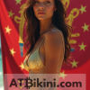 Indiana bikini contest woman in Golden bikini in front of Indiana state flag lookalike
